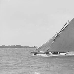 The 6 Metre Cheetal (L21) sailing upwind, 1911. Creator: Kirk & Sons of Cowes