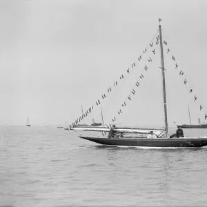 The 6 Metre Cremona moored with flags, 1913. Creator: Kirk & Sons of Cowes