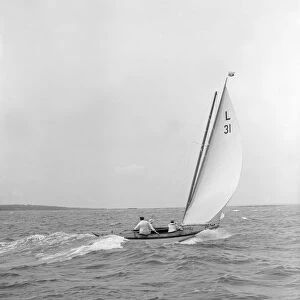 The 6 Metre Sandra sails downwind, 1913. Creator: Kirk & Sons of Cowes
