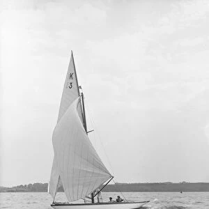 The 7 Metre Ancora (K3) sailing under spinnaker, 1913. Creator: Kirk & Sons of Cowes