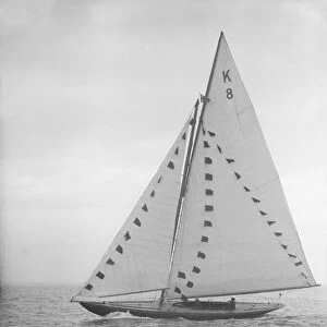 The 7 Metre sailing yacht Pinaster (K8) with prize flags, 1912