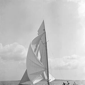 The 8 Metre Endrick sailing downwind under spinnaker, 1911. Creator: Kirk & Sons of Cowes
