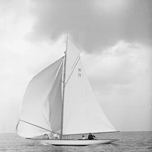 The 8 Metre Ventana (H11) sailing with spinnaker, 1912. Creator: Kirk & Sons of Cowes