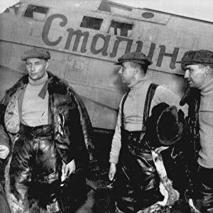 Alexander Belyakov, Georgiy Baidukov and Valery Chkalov by their plane on June 20, 1937. Artist: Anonymous