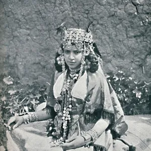 An Algerian woman in gala costume, 1912. Artist: Neurdein freres