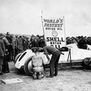BABS with Parry Thomas, having wheel changed at Pendine sands 1926. Creator: Unknown