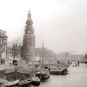 Barges on the canal in front of the Montelbaanstoren, Amsterdam, 1898. Artist: James Batkin