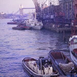 Barges in the Pool of London. River Thames and Tower Bridge, London, 1962. Artist: CM Dixon