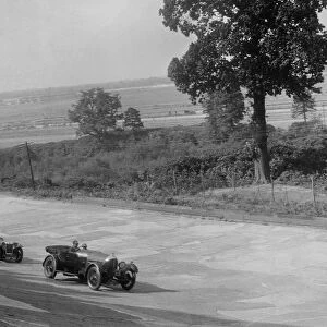 Bentley of FE Elgood and MG Magna of MB Watson racing at a MCC meeting, Brooklands, Surrey, 1933