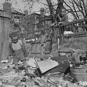 Two boys playing in their backyard, Washington (southwest section), D. C. 1942. Creator: Gordon Parks