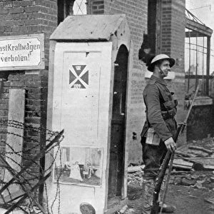 A British soldier on sentry duty after the fall of Peronne, France, First World War, 1917, (c1920)