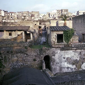 Buildings of Herculaneum with houses of the modern town of Ercolano above, Italy