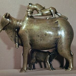 Cast bronze zebu-cow suckling her calf while a lion attacks her back, 13th century