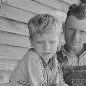 Charles and his father Floyd Burroughs, Alabama cotton sharecropper, 1936. Creator: Walker Evans
