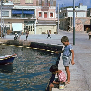 Children fishing in the harbour of Khania