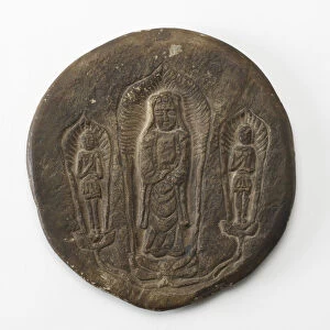 Circular plaque with Buddhist trinity on obverse... Period of Division, Dated 500 CE