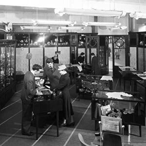 Customers in the Barnsley Co-op jewellery department, South Yorkshire, 1957. Artist