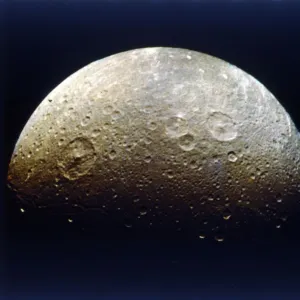 Dione, one of Saturns moons. Creator: NASA