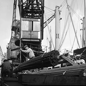 Dockers loading steel bars onto the Manchester Renown, Manchester, 1964. Artist