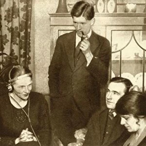 A family listening to the results of the general election of 1923, (1935). Creator: Unknown