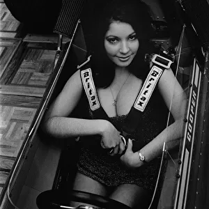 Female model in cockpit of Cooper F5000 at 1969 Racing Car show. Creator: Unknown