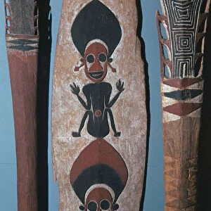 Detail of figures carved and painted on a ceremonial canoe paddle from the Solomon Islands