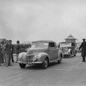 Ford V8 drophead of DB Hall at the RAC Rally, Madeira Drive, Brighton, 1939. Artist: Bill Brunell