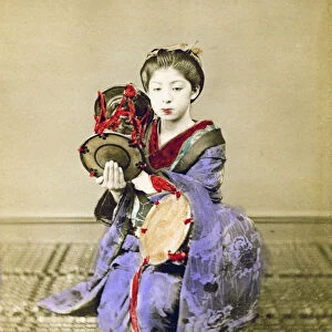 Geisha playing the tsuzumi, Japan, 1882. Artist: Felice Beato