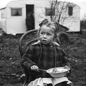 Gipsy girl eating, Lewes, Sussex, 1964