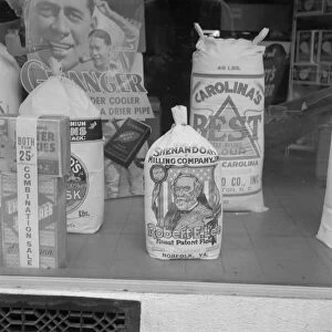 Grocery store window, Mebane, North Carolina, 1939. Creator: Dorothea Lange