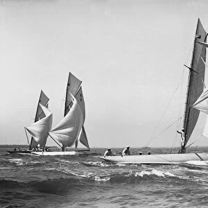 Group of 8 Metres sailing yachts racing downwind, 1911. Creator: Kirk & Sons of Cowes