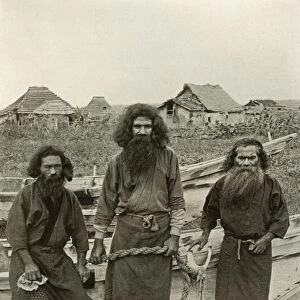 Happu Konno, The Hunter (In Centre) and Two Ainu Fishermen, 1910. Creator: Herbert Ponting