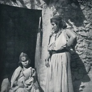 Kabyle women at the door of their dwelling near the Mediterranean coast, Algeria, 1912 Artist: Kuhn