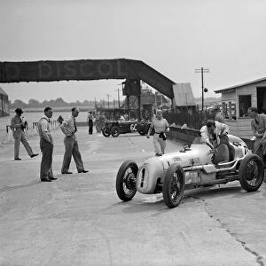 Kay Petre in an Austin 7 works team racing car, Brooklands, 1937. Artist: Bill Brunell