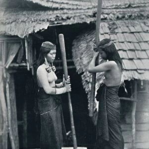 Kenyah women pounding rice, Sarawak, 1902. Artist: Dr Charles Hose