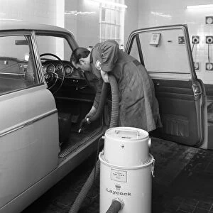 Laycock Vacacar vacuum cleaner in use at an Esso garage, Sheffield, South Yorkshire, 1965