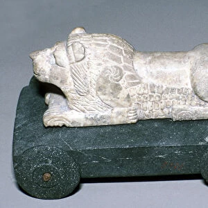 Limestone and bitumen lion mounted on a wheeled base, Susa, c12th century BC