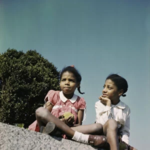 Two little girls in a park near Union Station, Washington, D. C. ca. 1943. Creator: Unknown