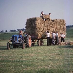Loading bales of hay, England, c1960. Artist: CM Dixon