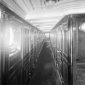 Long wood panelled corridor on steam yacht Venetia, 1920. Creator: Kirk & Sons of Cowes