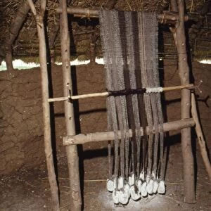 Loom with chalk loom weights, Butser Iron Age Farm, c20th century. Artist: CM Dixon