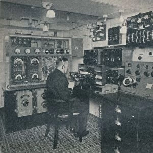 A Marconi wireless operator receiving wireless messages as the Empress of Britain crosses the Atlan