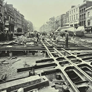 Men laying tramlines at a junction, Whitechapel High Street, London, 1929