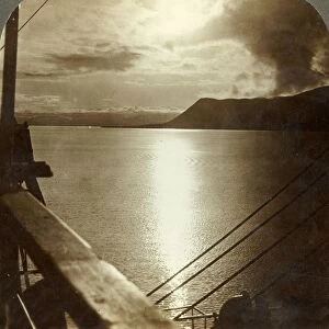 The Midnight Sun in July over cliffs of Spitzbergen and Arctic Ocean, c1905. Creator: Unknown