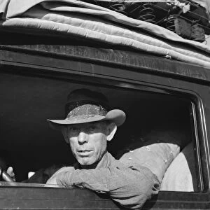 Migratory cotton picker on highway near Merced, California, 1939. Creator: Dorothea Lange