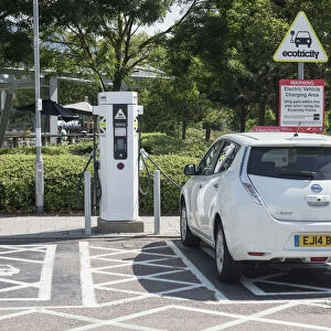 Nissan Leaf at elctric charging point 2015. Creator: Unknown