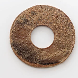 Pendant in the form of a disk (bi) with raised knobs, Zhou dynasty, 475-221 BCE