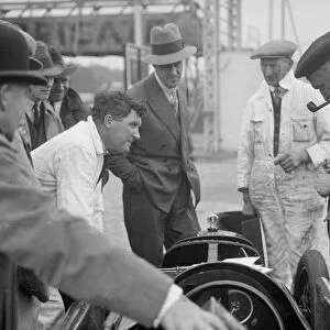 People examining Leon Cushmans Austin 7 racer at Brooklands for a speed record attempt, 1931
