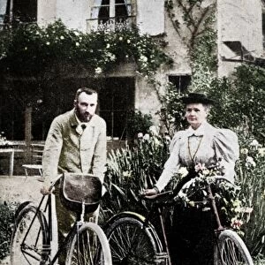 Pierre and Marie Curie, French physicists, preparing to go cycling