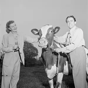 Portrait of Enric Madriguera and Patricia Gilmore on their farm, Connecticut, ca. June 1947. Creator: William Paul Gottlieb